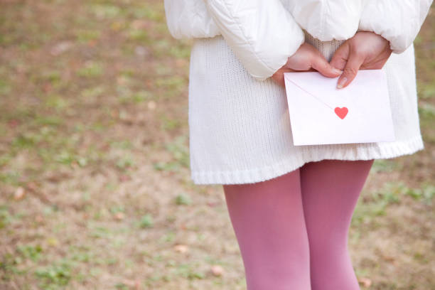Female holding a love letter